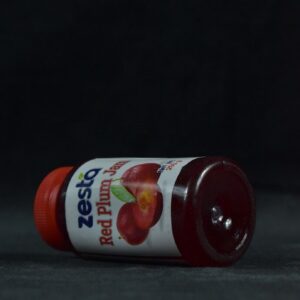 a bottle of ketchup sitting on a table