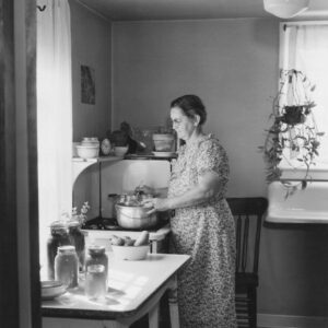 Woman cooking at a stove in a kitchen